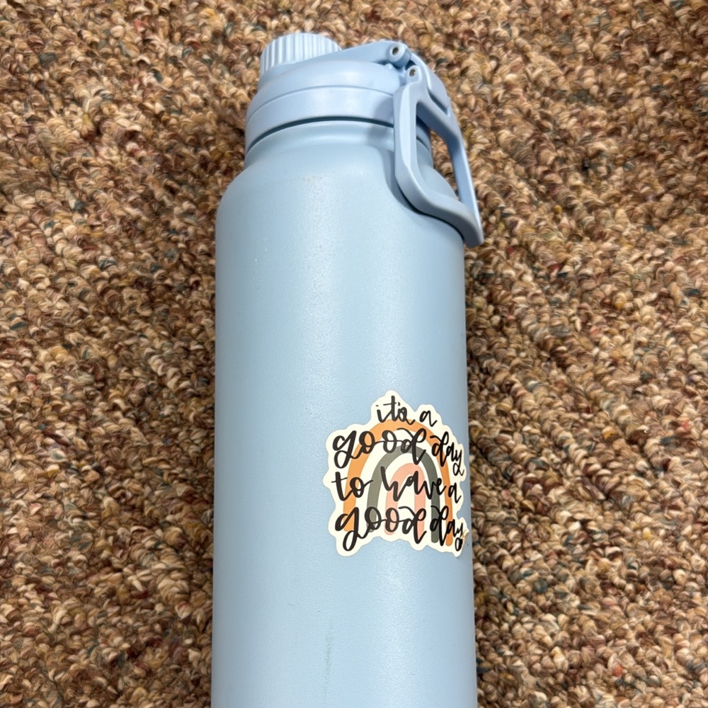 Light Blue Water Bottle with Motivational Sticker